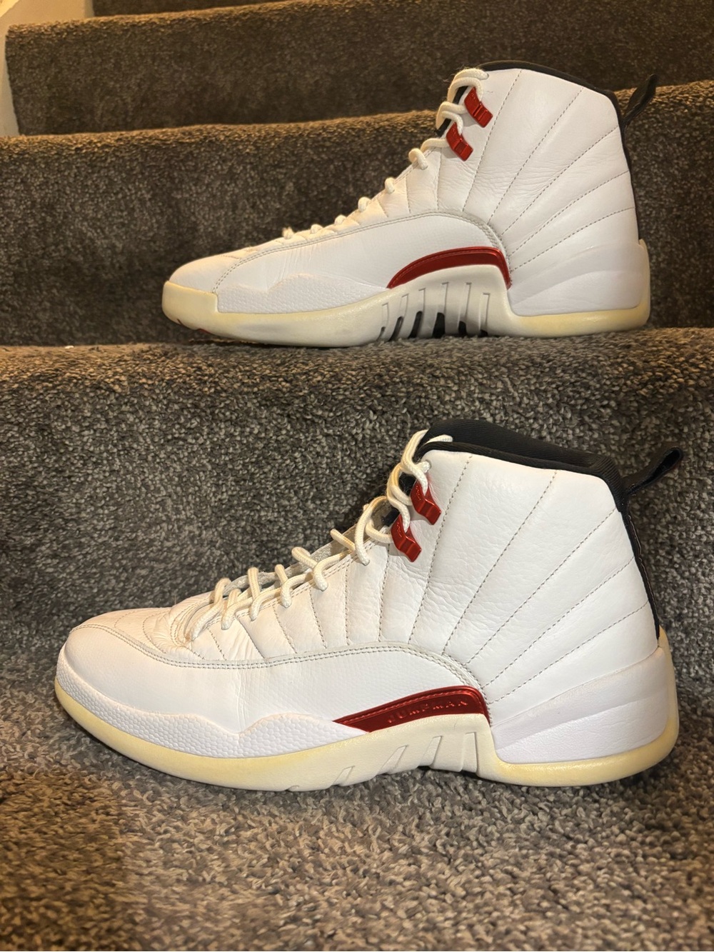 The Nike Air Jordan 12 Retro Twist in size 12 features a classic red and white